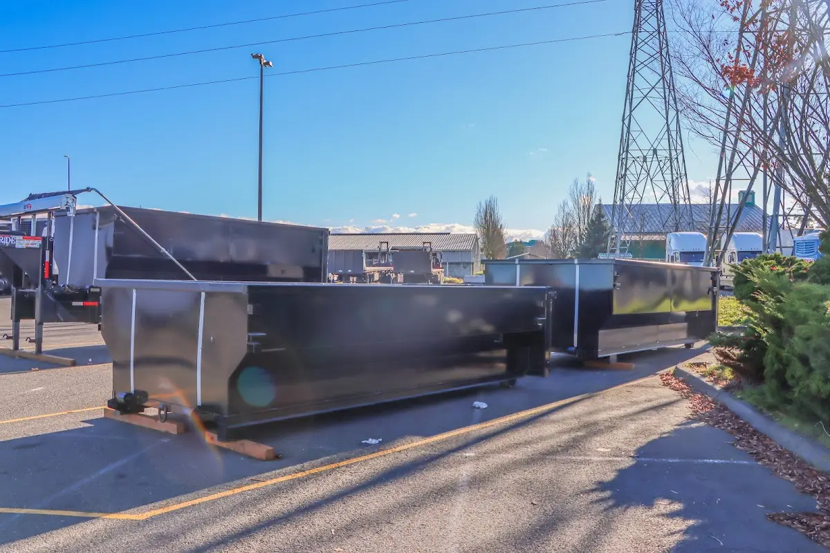 Roll-off dumpster ready for waste disposal at job site for 2 Yard Dumpster Rental in Lisbon